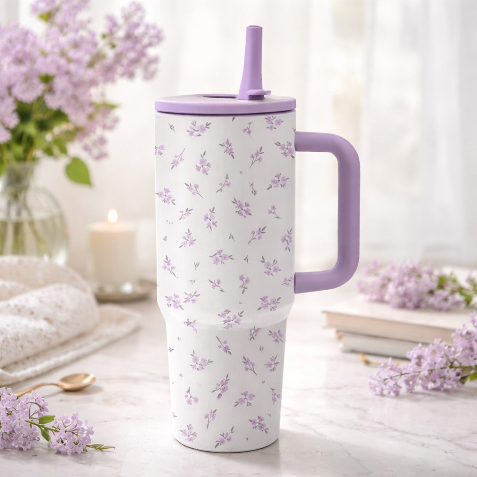 A 40-Ounce Stainless Steel Cup with a Handle And Flip-Top Straw Design, Featuring a Floral Pattern. It Fits Most Cup Holders, Has a Splash-Proof Structure, a Non-Slip Base, And Is Double-Walled for Both Hot And Cold Use. Reusable