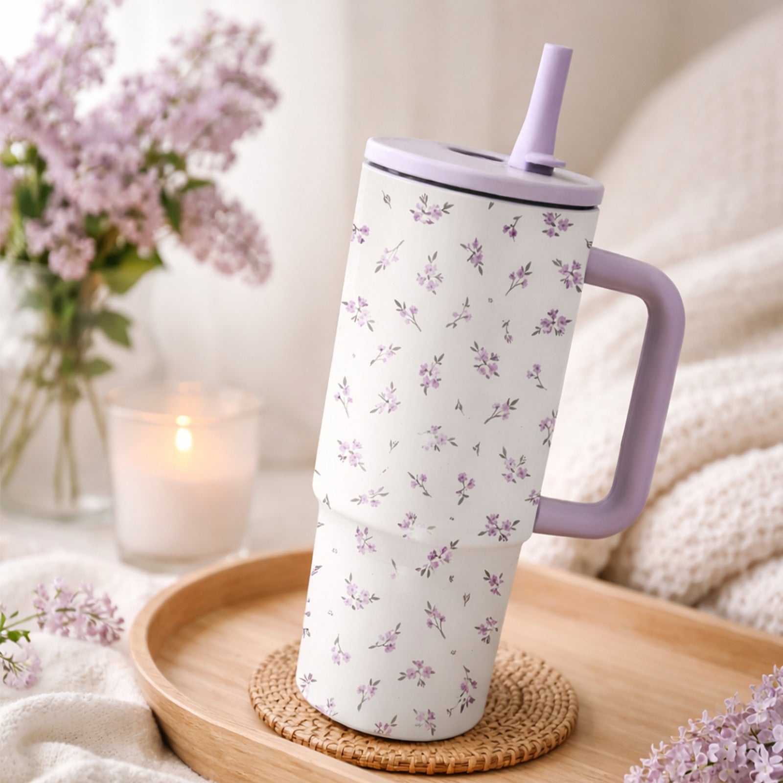 A 40-Ounce Stainless Steel Cup with a Handle And Flip-Top Straw Design, Featuring a Floral Pattern. It Fits Most Cup Holders, Has a Splash-Proof Structure, a Non-Slip Base, And Is Double-Walled for Both Hot And Cold Use. Reusable